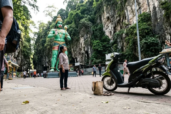 The green Hanuman statue at the entrance to Ramayana Cave