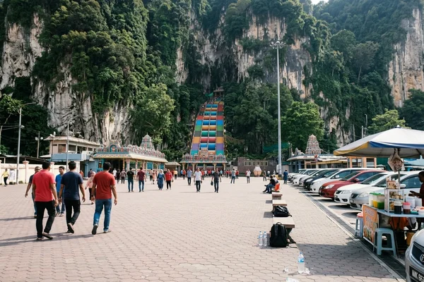 The Batu Caves limestone hill and rainbow staircase seen from the forecourt