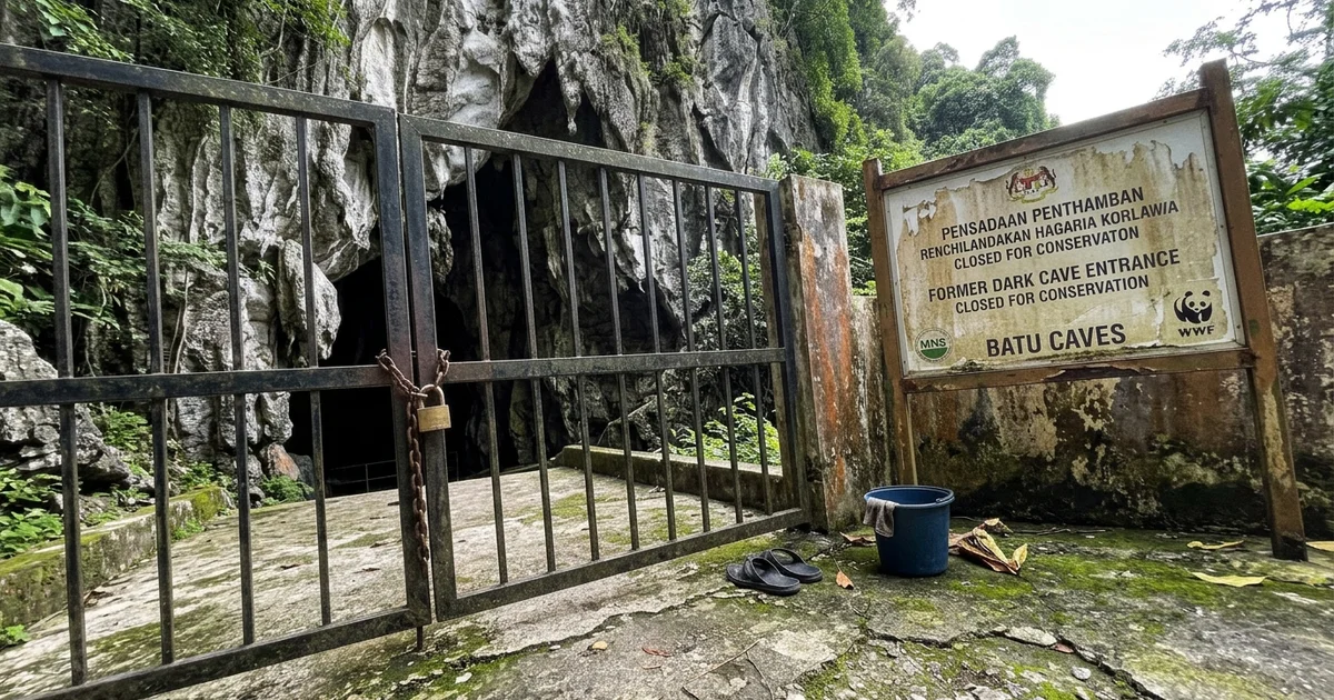 The closed, gated entrance to the former Dark Cave at Batu Caves