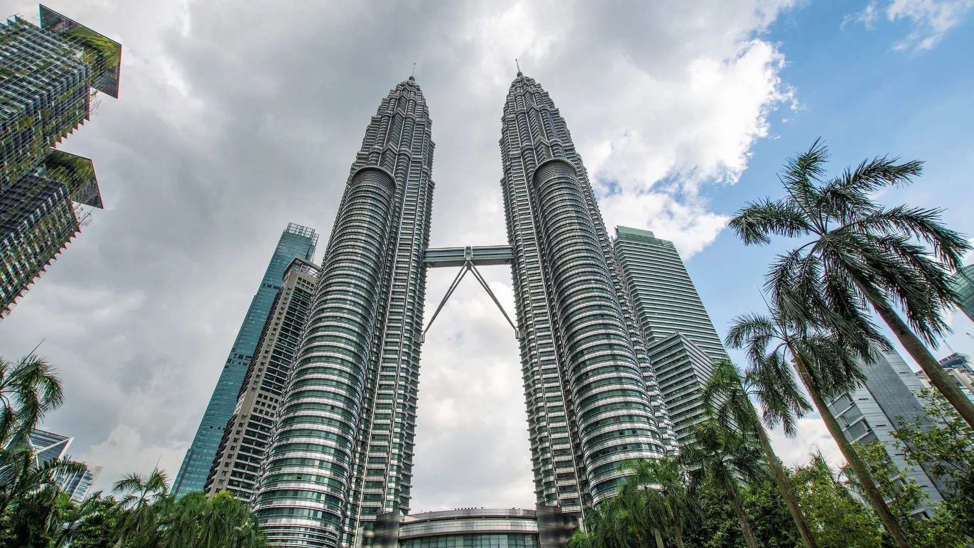 The Petronas Twin Towers and skybridge seen from below at KLCC, where this itinerary meets
